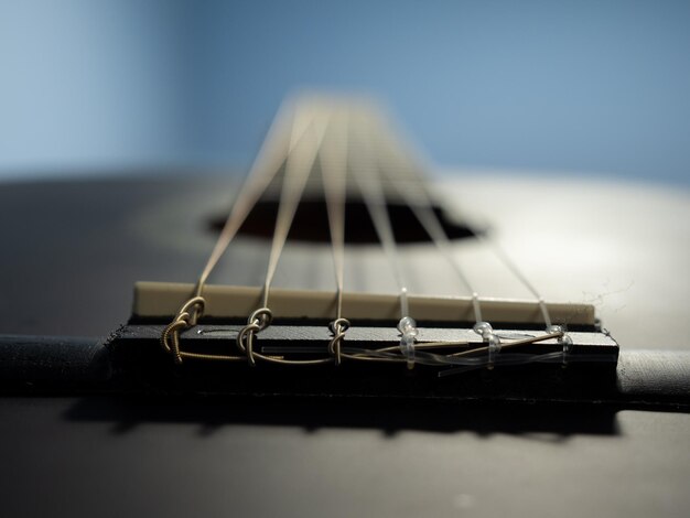 Close-up of guitar on table