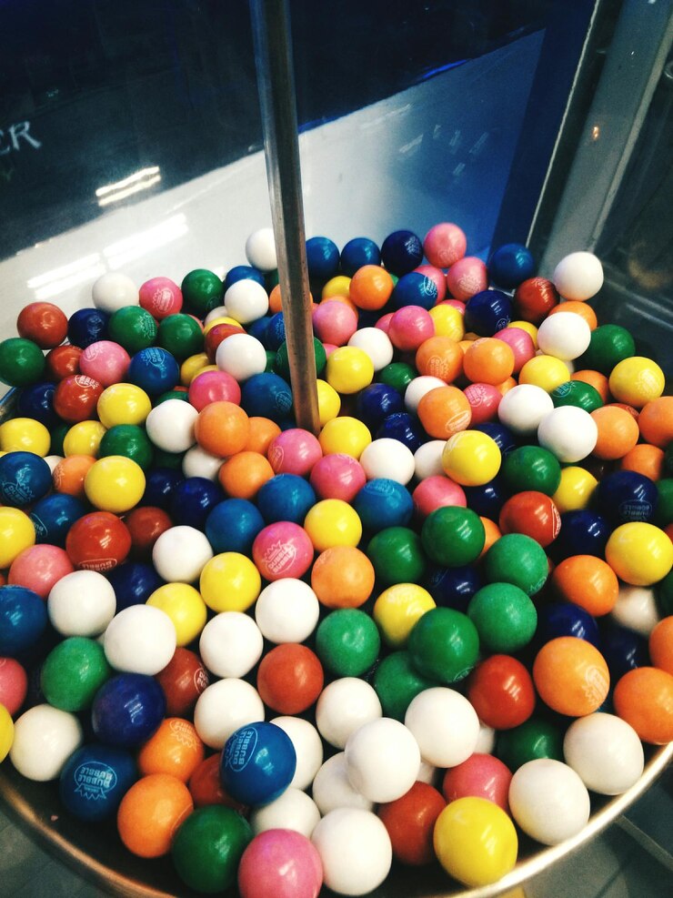 Photo close-up of gumball machine