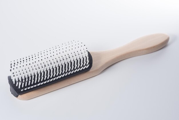 Photo close up of hairbrush over white background