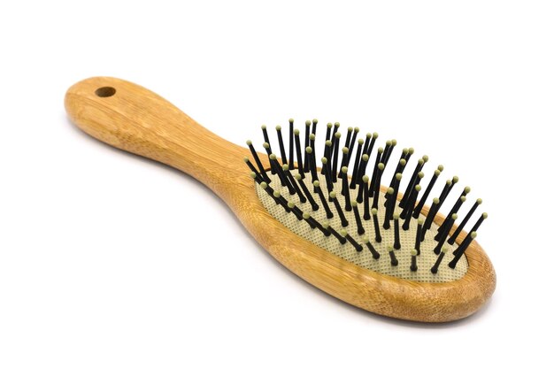 Photo close-up of hairbrush over white background