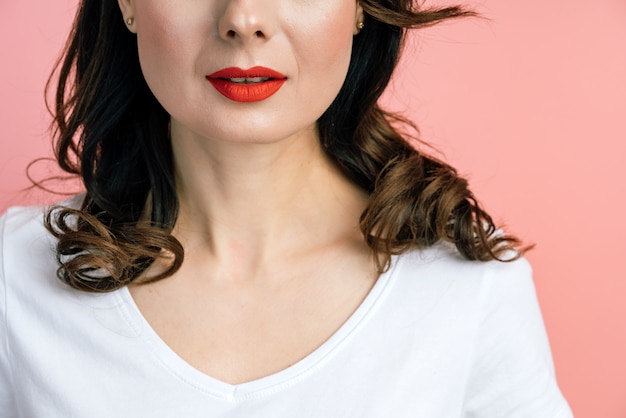 Close up, half of a womans face, red lips.