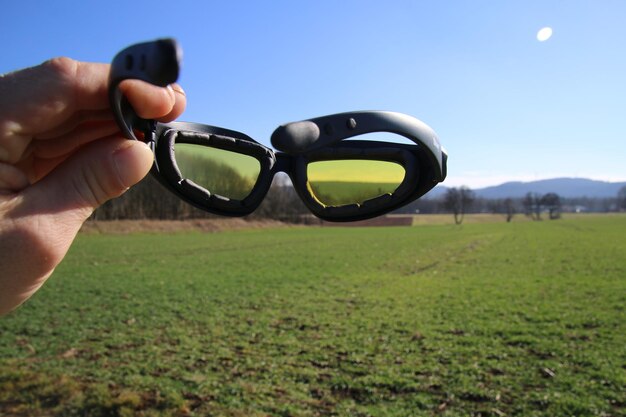 Close-up of hand against clear sky