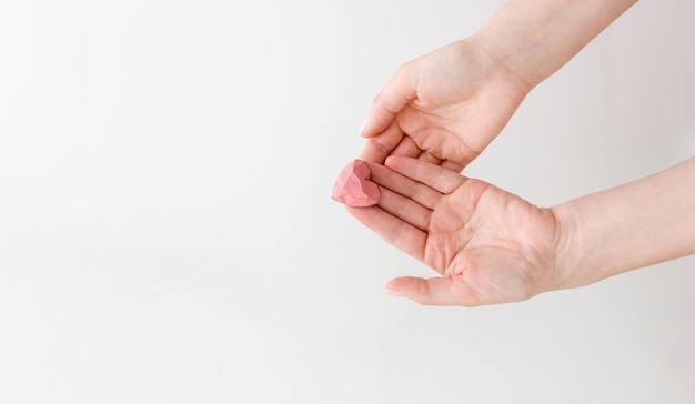 Close-up of hand against white background