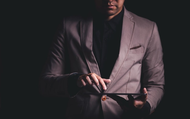 Close up hand of businessman with tablet Concept of technoloy for business