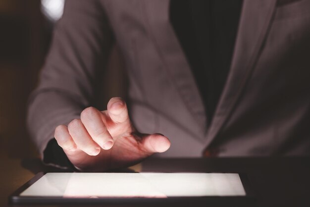 close up hand of businessman with tablet concept of technoloy for business