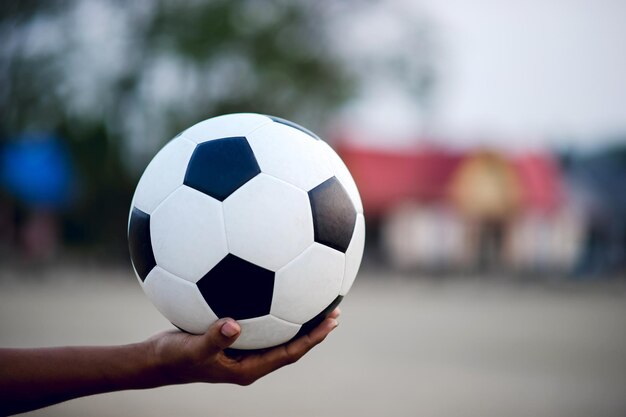 Close-up of hand holding ball