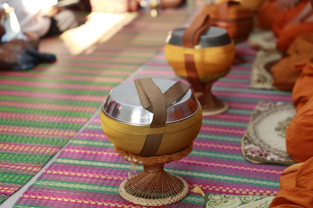 Close-up of hand holding basket on table