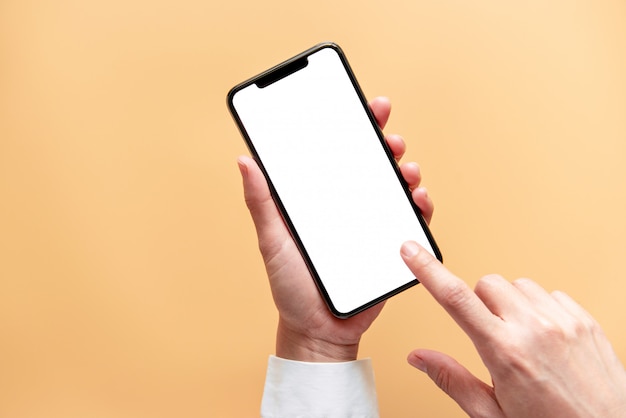 Close up hand holding black smartphone white screen