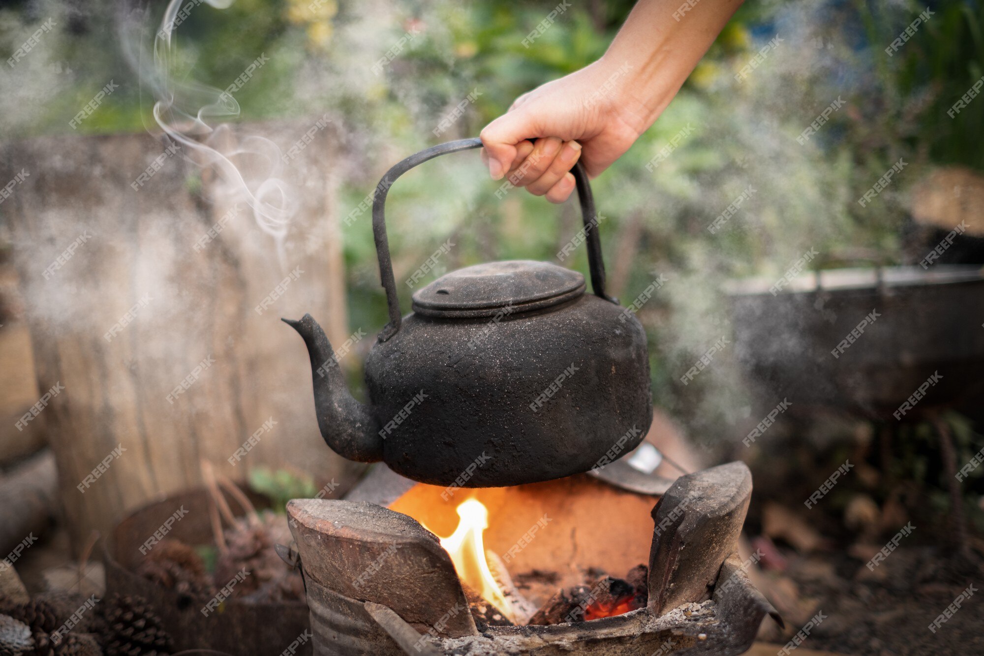 Boiling Water In Traditional Old Pot On Charcoal Stove Brazier Stock Photo,  Picture and Royalty Free Image. Image 38642693.