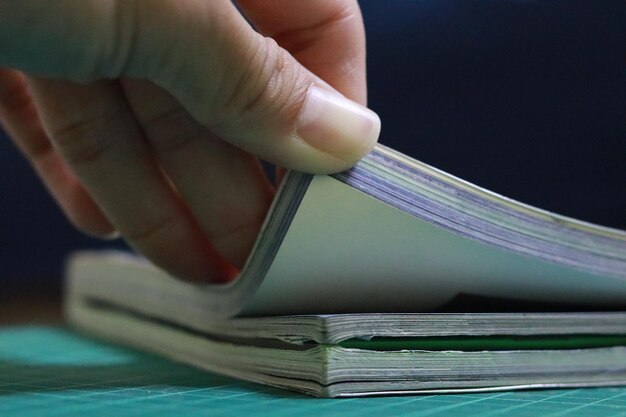 Close-up of hand holding book