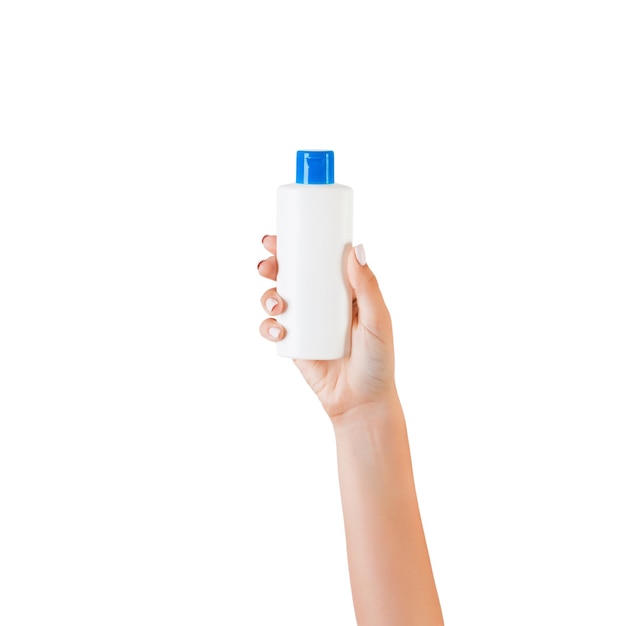 Photo close-up of hand holding bottle against white background