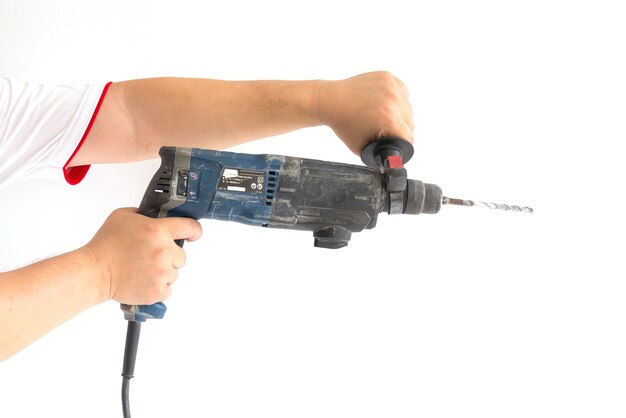 Photo close-up of hand holding camera against white background