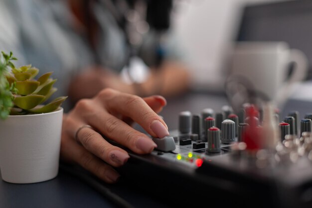 Close-up of hand holding camera on table