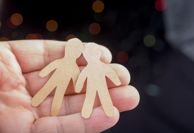 Photo close-up of hand holding christmas decoration