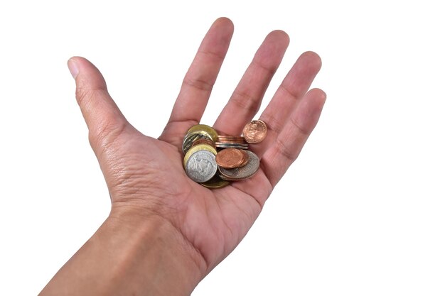 Close-up of hand holding coins against white background