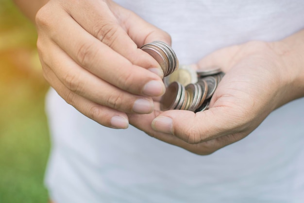 close-up of hand holding coins