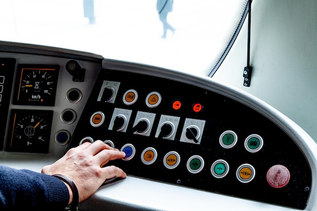 close-up of hand holding control panel
