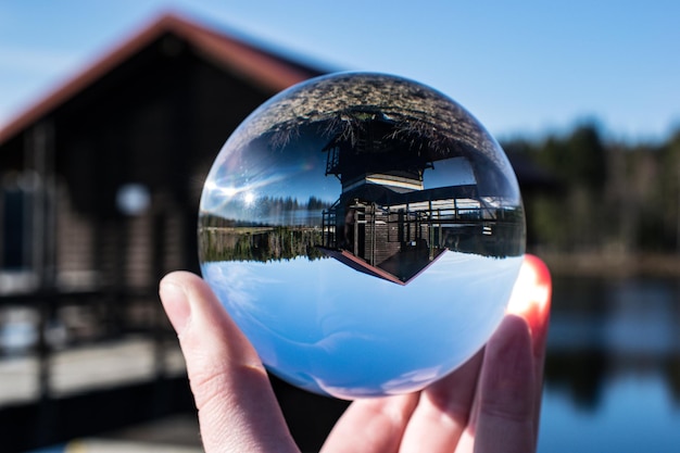 Photo close-up of hand holding crystal ball