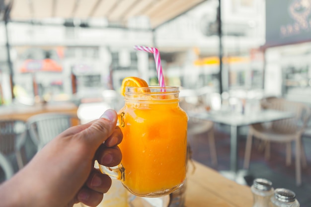 Close-up of hand holding drink