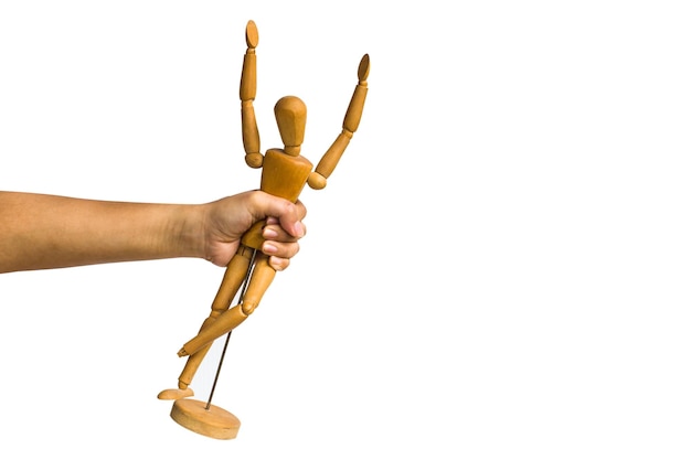 Photo close-up of hand holding figurine over white background