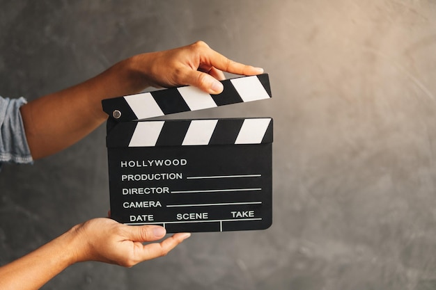 Photo close-up of hand holding film slate