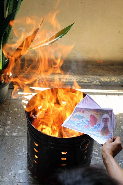 Close-up of hand holding fire