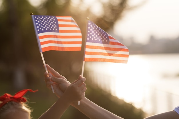 Photo close-up of hand holding flag