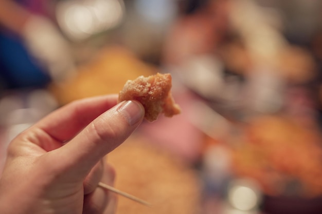 close-up of hand holding food