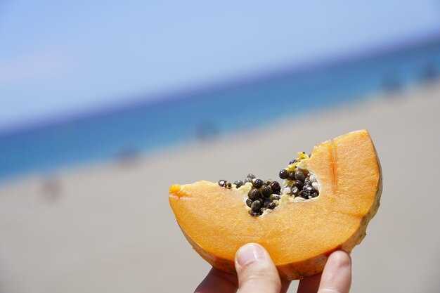 Close-up of hand holding fruit