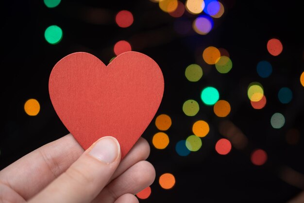 Photo close-up of hand holding heart shape