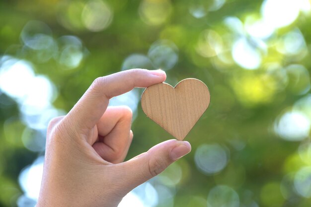 Close-up of hand holding heart shape