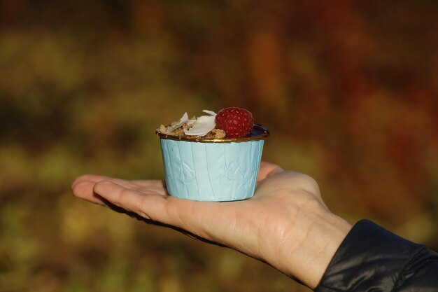 Close-up of hand holding ice cream