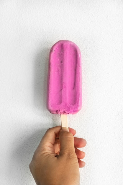 Close-up of hand holding ice cream