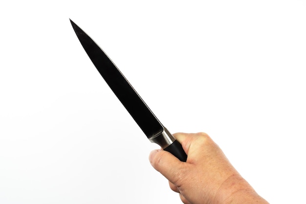 Photo close-up of hand holding knife over white background