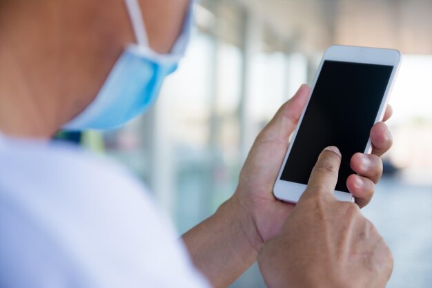 Close-up of hand holding mobile phone