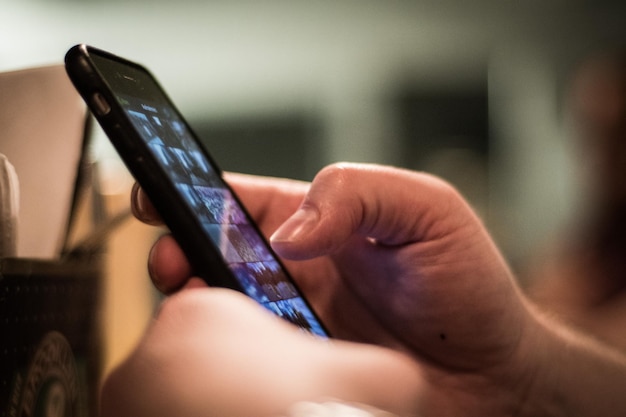 close-up of hand holding mobile phone
