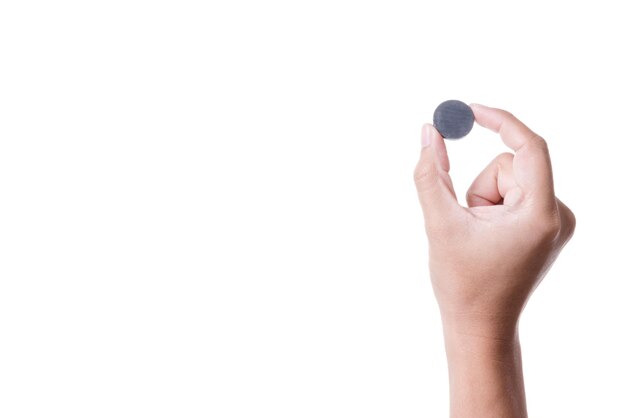 Close-up of hand holding object against white background