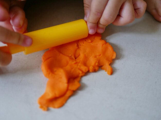 Close-up of hand holding orange