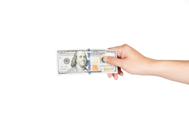 Photo close-up of hand holding paper currency against white background