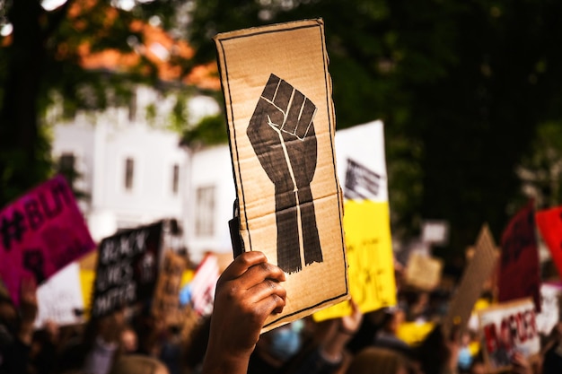 Photo close-up of hand holding paper flag