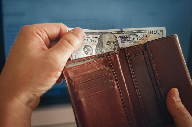 Close-up of hand holding paper