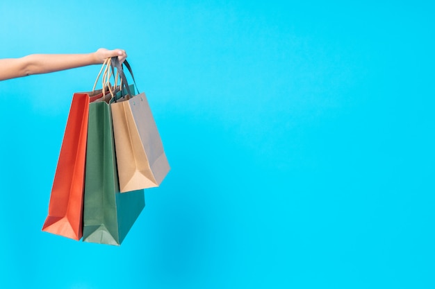 Close up hand holding shopping bag