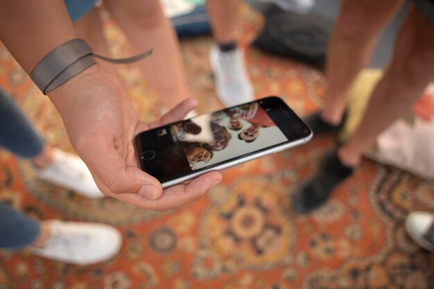 Close up hand holding smartphone