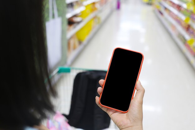 close up hand holding smartphone