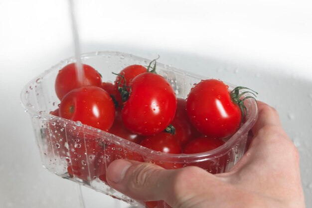 Close-up of hand holding strawberries