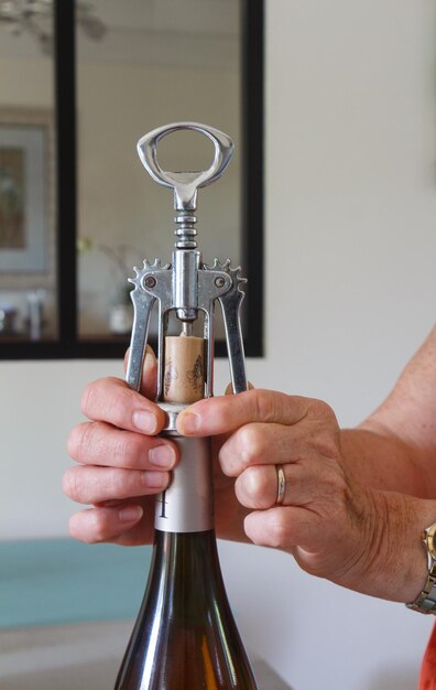 Close-up of hand holding wine glass