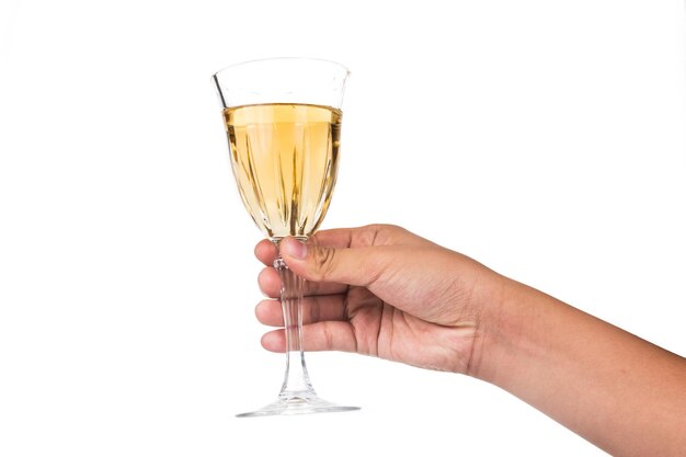 Photo close-up of hand holding wineglass against white background