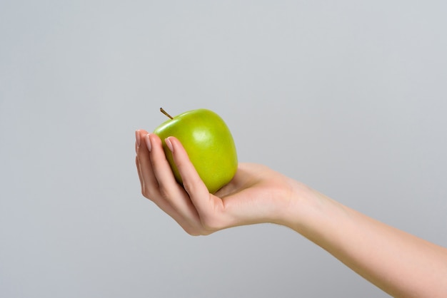 Close Up. Hand Holds Apple. Proper Nutrition.