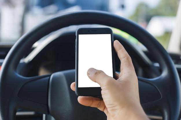 Close up hand man using smartphone with white screen driving car