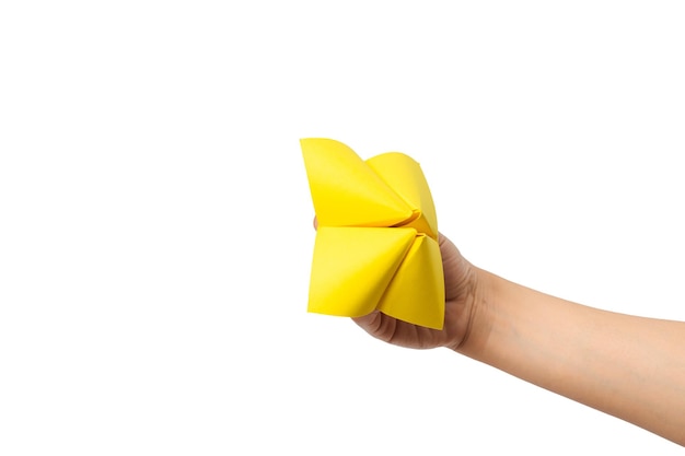 Close up of hand in a paper fortune teller isolated on white background